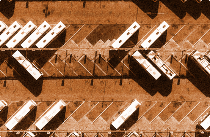 Hitachi Energy Project image, showing a top down view of bus fleet parket neatly in a grid